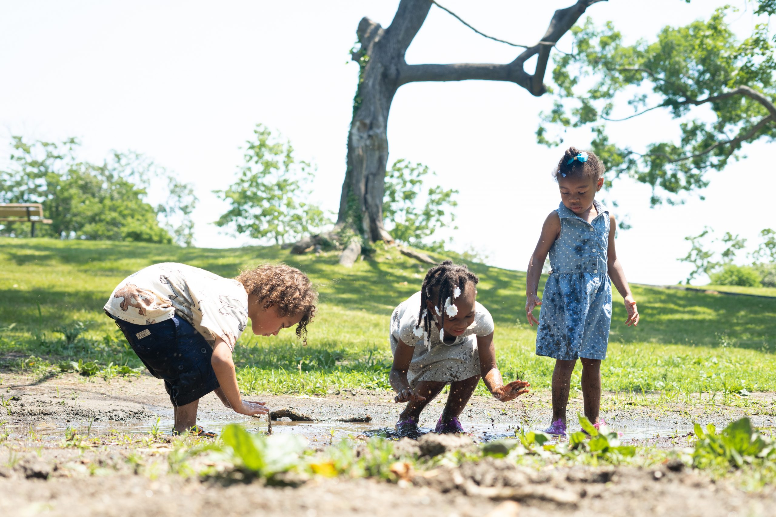 Kids playing outside in the mud